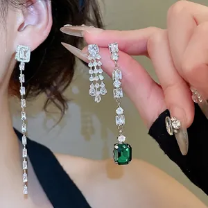 Elegant sterling silver drop earrings with emerald cut green stone and zircon tassels