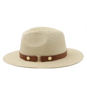 Close-up of beige straw sun hat with brown leather belt and gold H-buckle detail