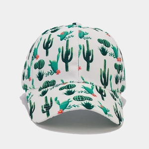 Close-up of tropical green cactus pattern on white breathable cotton baseball cap