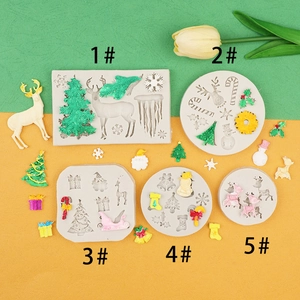 Macro detail of Christmas silicone molds with reindeer, snowflake and tree relief patterns
