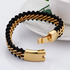 Men's woven leather bracelet with gold-plated stainless steel clasp on a white plate