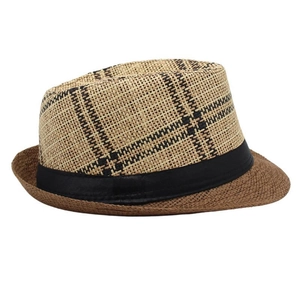 Close-up of the woven checkered crown and solid brown brim of this vintage straw fedora hat