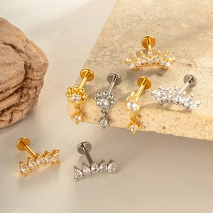 Star-shaped F136 titanium lip and ear studs with cubic zirconia in gold and silver