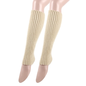 Detail of beige ribbed knit leg warmers showing high-elasticity texture for winter