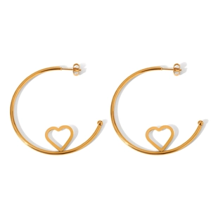 Detail of golden stainless steel hoop earrings with hollow heart design and polished finish