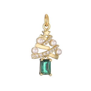 Detail of Christmas tree pendant with gold finish, white pearls and green gemstone