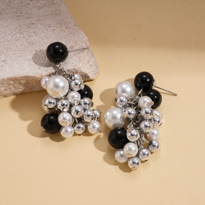 Cluster bead earrings with black beads, white faux pearls and silver accents on stone