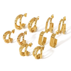 Close-up of five pairs of 18k gold plated stainless steel C-shape twisted hoop earrings