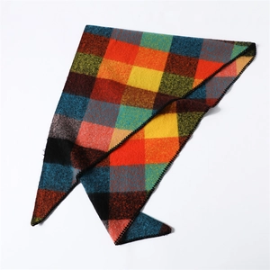 Close-up of a colorful checkered triangle scarf with detailed decorative overlock stitching