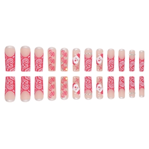 Christmas press-on nails set featuring red French tips, snowflakes, and Santa art
