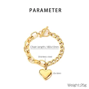 Macro view of 18k gold plated stainless steel bracelet with heart charm and OT toggle clasp