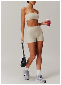 Beige yoga set detail showing seamless rib-knit fabric on crop top and high waist shorts