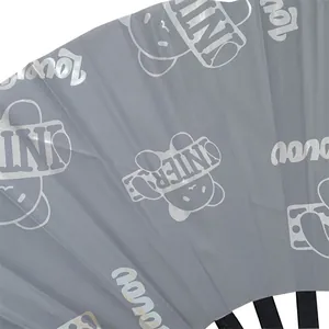 Close-up of grey folding fan featuring cartoon bear prints and bamboo ribs for parties