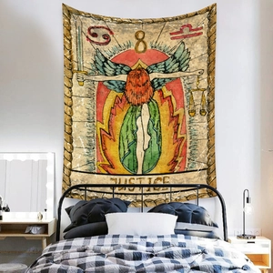 Detail of vintage Justice Tarot tapestry with astrological symbols on white bedroom wall