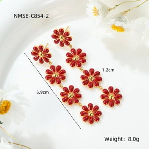 Detailed view of red daisy enamel earrings in gold-tone steel with 5.9cm length