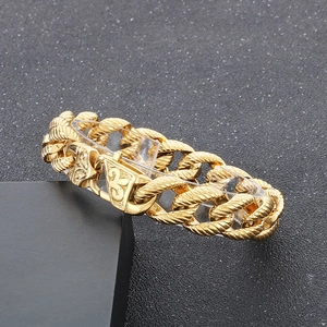 Macro view of gold 18k plated titanium steel chain with engraved iris emblem clasp