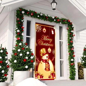 Hanging Christmas door flag featuring snowman and golden gifts in front of white porch