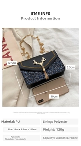 Detail of black sequin crossbody bag with golden deer head accent and tassel charm