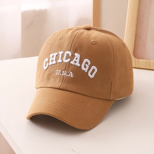Close-up of khaki cotton baseball cap with white 3D Chicago USA embroidery detail