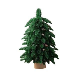 Green 55cm PE mini Christmas tree with snow flocking and natural wood base
