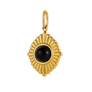 Macro shot of gold stainless steel pendant with black gemstone and sunburst texture