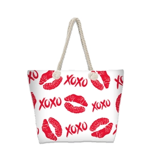 Large beach tote bag with red lips and XOXO print featuring rope handles on white background