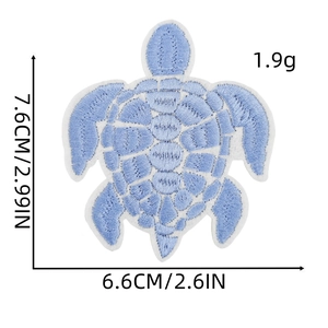 Detail of light blue sea turtle embroidery patch showing precise size 7.6cm x 6.6cm dimensions