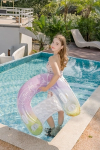 Detailed view of U-shaped pool lounger with glitter filling and two cup holders