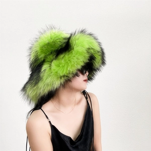 Close-up of fluffy faux fur texture in neon green and black on a thick winter hat