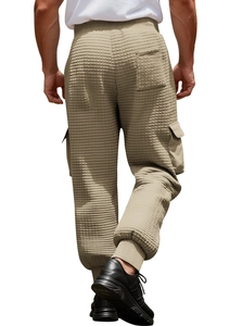 Detail of khaki waffle knit cargo joggers featuring ribbed cuffs and side flap pockets