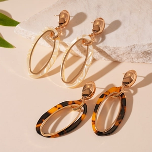 Vintage tortoiseshell and marble resin oval hoop earrings with gold metal frame