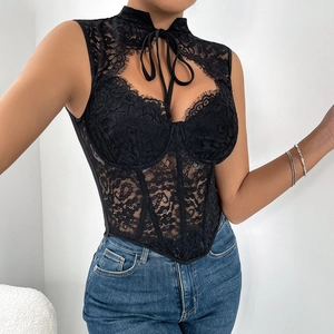Close-up of black floral lace corset top with halter neck bow and boning details