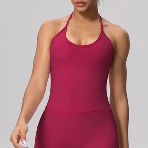 Close-up of deep red yoga top showing premium matte texture and halter back details