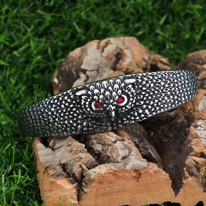 Vintage stainless steel owl cuff bracelet with red rhinestone eyes and feather texture