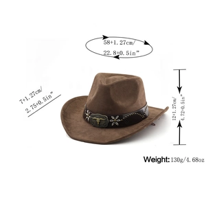 Detail of suede western cowboy hat with metal bull head buckle and decorative rivets