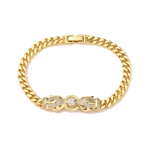 Detailed view of leopard heads gold bracelet with sparkling cubic zirconia on cuban chain