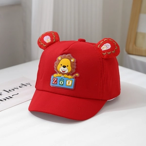 Detail of red baby baseball cap with 3D ears and cute cartoon lion zoo patch