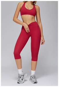 Women's red brushed yoga set featuring cross waist high-rise leggings and halter neck bra