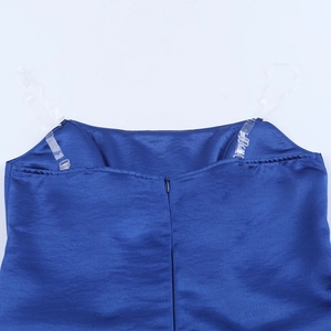 Detail of navy blue satin dress neckline with clear straps and invisible zipper