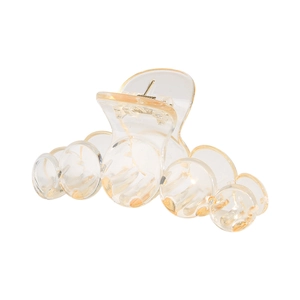 Detail of transparent light yellow acrylic hair claw clip with spring mechanism