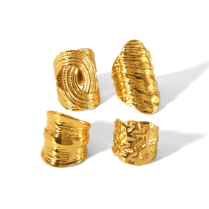 Set of four textured gold-plated stainless steel wide rings with hammered finish