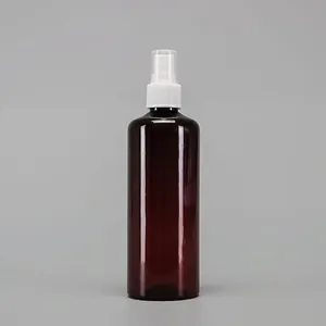 Detail of amber PET spray bottle with white fine mist pump and transparent cap