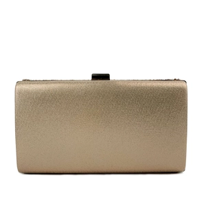 Close-up of sparkling gold evening clutch with metallic fabric texture and metal handle