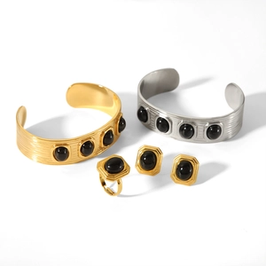 Luxurious titanium steel jewelry set with black gemstones and vintage C-shaped open bangles