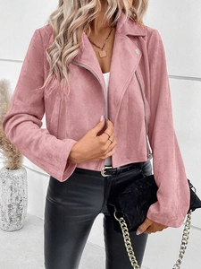 Detail of pink faux suede jacket featuring metal zippers and notched lapels on female model