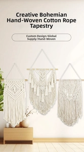 Detail of bohemian macrame wall hanging featuring hand-woven geometric patterns and cotton tassels