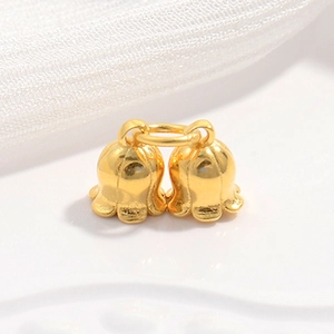 Elegant pair of gold lily of the valley flower pendants for DIY jewelry making and crafts
