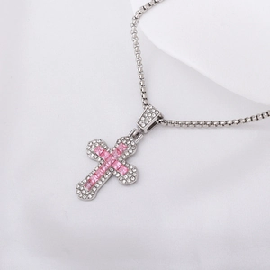 Elegant silver cross necklace with pink square gemstones and shimmering rhinestones