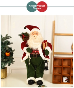 Detail of Santa Claus figure with rustic sack, gift box, and vintage black lantern decor