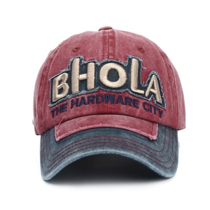 Detail of red vintage washed baseball cap with 3D BHOLA embroidery and worn texture